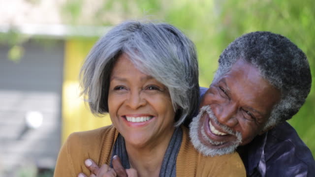 Loving African American couple being affectionate to each other at home